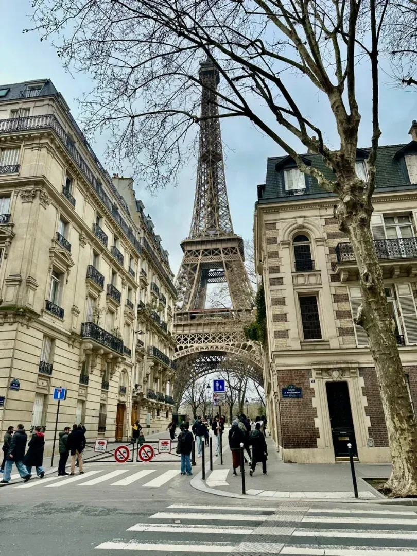 Eiffel Tower seen from a quiet Paris street